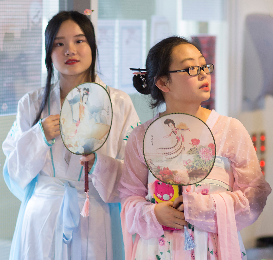 Two exhange students in Chinese dresses.